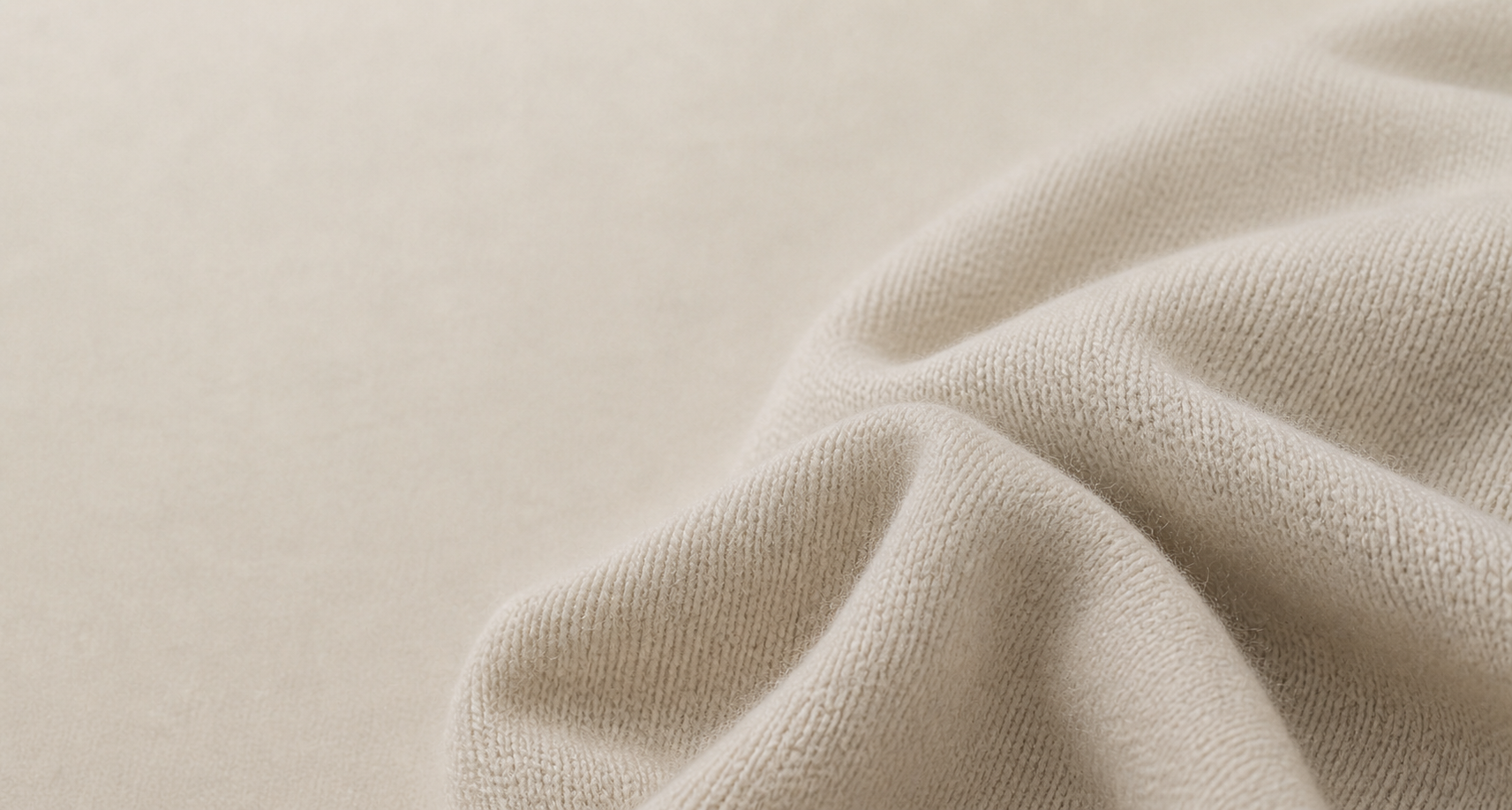 Soft cream knit textile, close detail